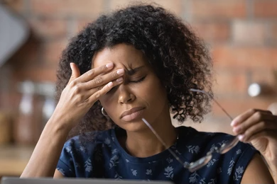 A business owner taking a moment to think through financial stress